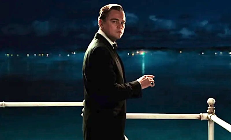 Leonardo DiCaprio as Gatsby with the Green Light in the distance